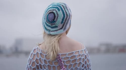 Stylish Woman With Crochet Hat Near Urban Waterfront