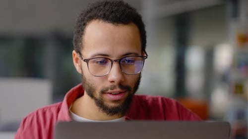 Man in Video Conference in Urban Workplace
