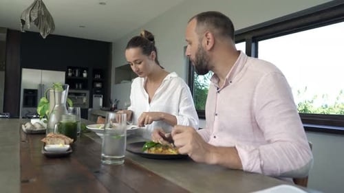 Couple enjoys meal together at the counter