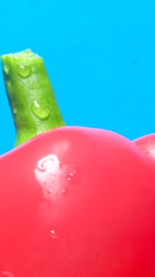 Vibrant Red Pepper Close-Up on Blue Background