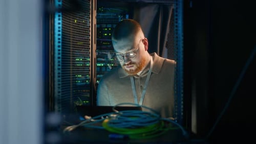 Focused System Administrator Works on Servers