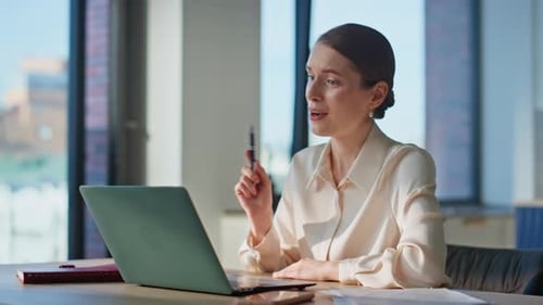Woman Participating in Video Call in Office