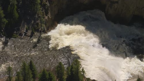 Gibbon falls plunges down a rocky cliff in Yellowstone national park Wyoming