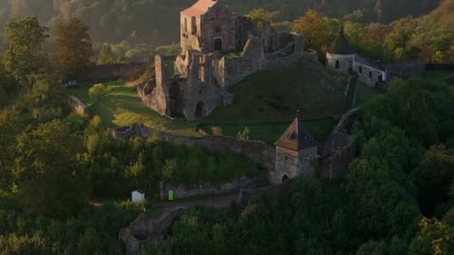 Aerial view of castle ruins at sunrise, Czech Republic.