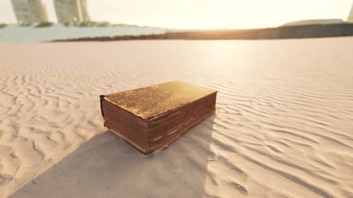 Old Book on the Sand Beach