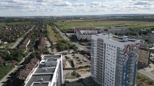 A Stunning Aerial View Showcasing the Urban Development Alongside Vibrant Green Spaces Clip