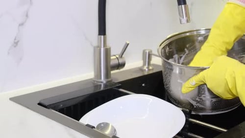 Washing Dishes in the Sink with Gloves
