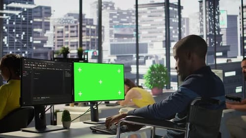 Person with Disability in Wheelchair Checking Code on Mockup PC