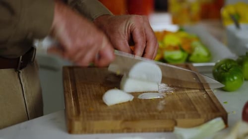 Slicing Onions on Cutting Board for Home Cooking