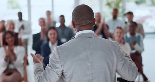 Presentation, back or businessman in office with applause, praise or success in training workshop