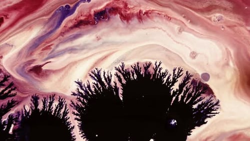 Macro Shot of Dark Ink Spreading in Colors