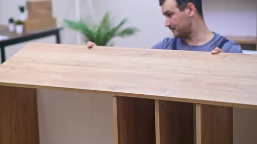 Custom Furniture Production and Delivery Professional Master Putting Smooth Wooden Plank on Rack