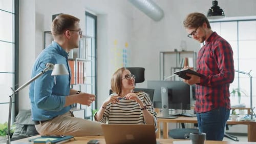 Business Team Discussing Project in Creative Office