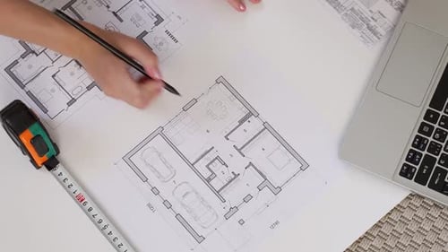 Architects Draw Drawings an Architectural Project is Under Development of a New House