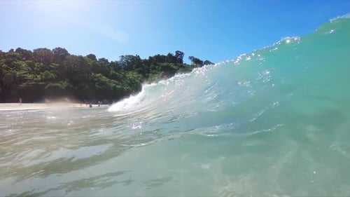 Small wave barrels over the beach