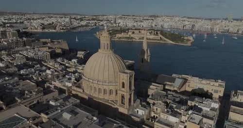 Aerial view of historic city with cathedral and river, Valletta, Malta.