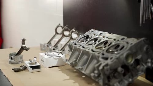 Disassembled Engine Parts Displayed for Overhaul Include Cylinder Head Pistons Liners Crucial