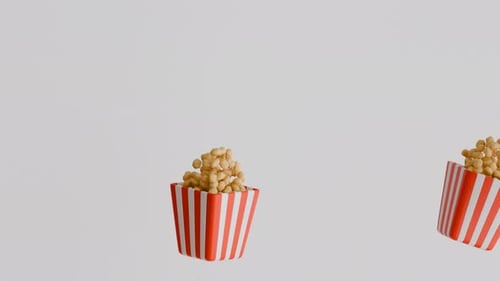 Flying lots of popcorn on a White background. Corn seeds. 3D loop animation of Floating popcorn