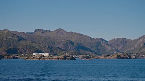 POV Ferry Shot Featuring Mountains And Blue Sky