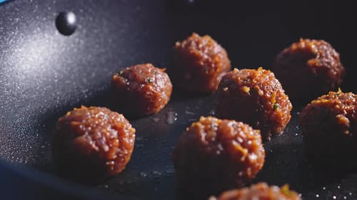 Cooking Meatballs Made With Lean Ground Turkey Meat. close up, slider shot