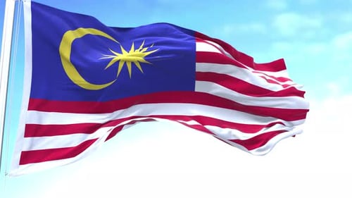 Realistic Malaysian Flag Waving in Slow Motion Against Blue Sky