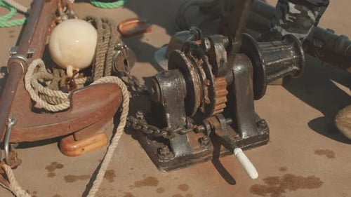 Operating a Nautical Metal Winch on Boat Deck