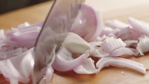 Chef Chopping a Red Onion with a Knife on the Cutting Board Macro Close Up of Cutting Red Onion on