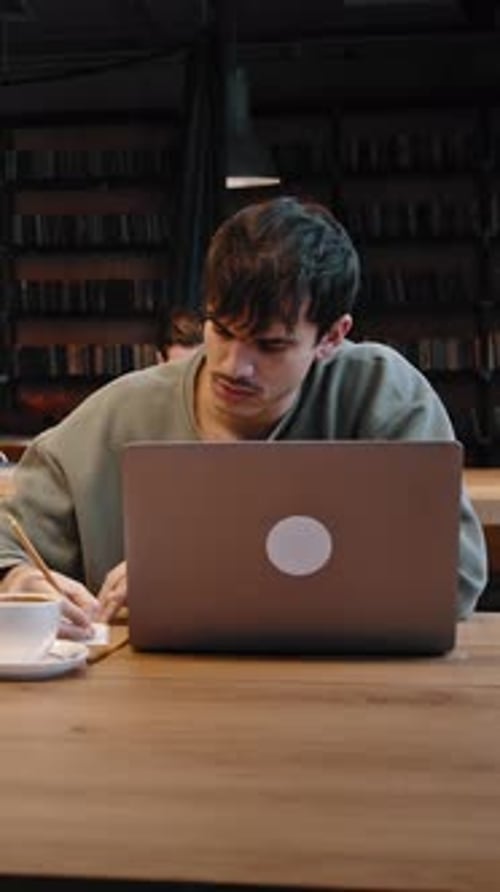 Group of Millennial Students Engaged in Learning at Public Library