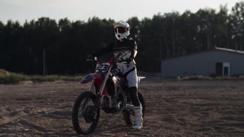 Motorcycle Rider with Protective Gear Outdoors on Dirt Bike