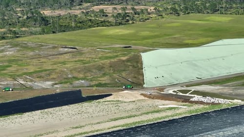 Aerial View of Dump Trucks at Rural Landfill