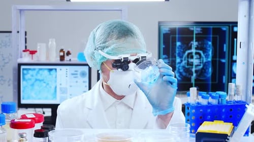 Scientist Holds Petri Dish in Bright Research Lab