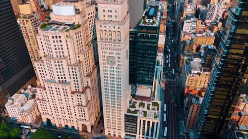 Beautiful tower with a round clock on the façade. Architecture of modern New York, USA.