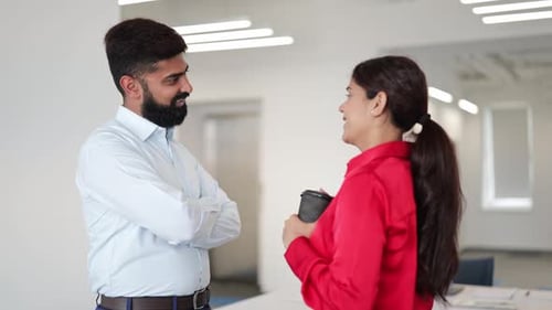 Indian Business Professionals Having Office Conversation