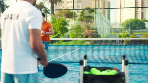 Padel, sport and coach with man, court and practice for challenge, wellness