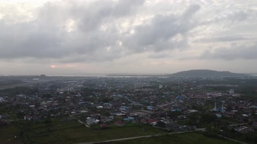 Aerial view of sunrise covered in dark clouds