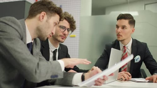 Corporate Team Brainstorming Ideas in Conference Room