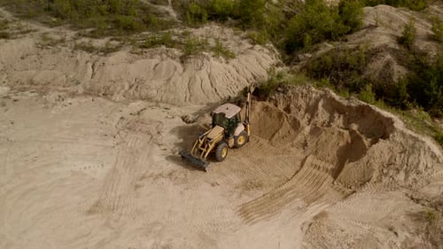 A Bulldozer Excavator Works in a Sand Deposit Career