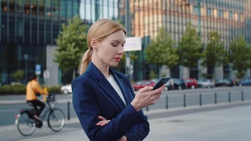 Portrait Medium Shot Independent Businesswoman Using Smartphone Standing Near Modern Office