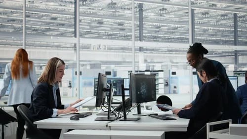 Senior Manager Analyzing Chip Architecture with AI Model in Microchip Factory