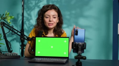 Influencer in Home Studio Reviewing Chroma Key Laptop
