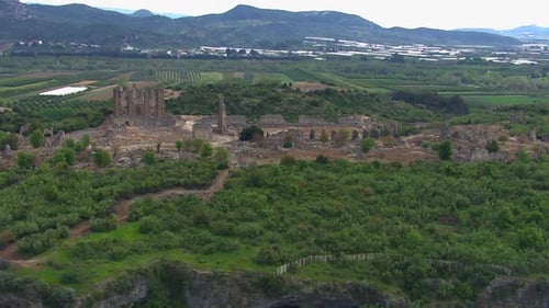 Low establishing shot of the historic Aspendos ruins site in Turkey