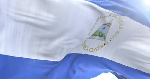 Nicaragua National Flag Waving Realistically in Blue Sky