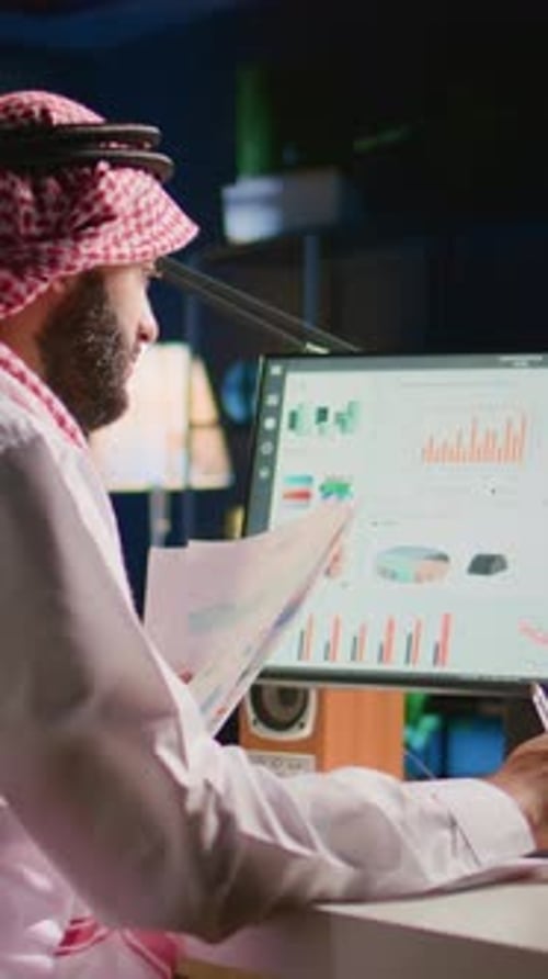 Mature Adult Working at Desk with Computer
