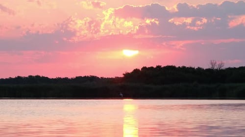 Early morning on calm river with fog. Sunrise over lake and beautiful morning landscape