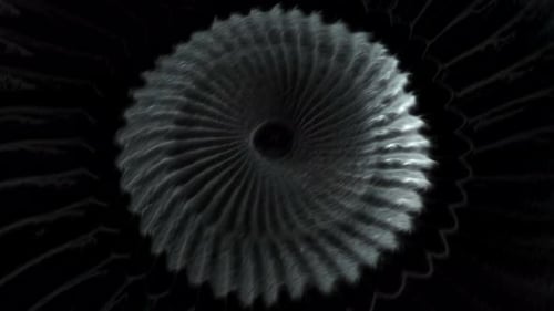 Un énorme ressort de couleur grise et bleue se déplace en spirale en animation.