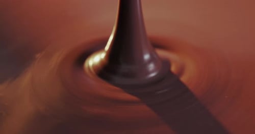Molten Chocolate Pouring and Rippling in Close Up