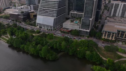 Aerial View of Contemporary Skyscrapers and Vibrant Greenery By the River in Downtown Austin Texas