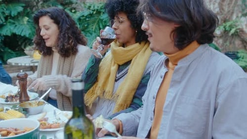 Friends and Family Share an Outdoor Meal