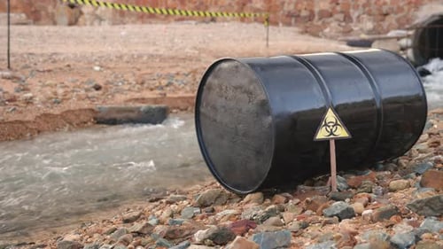 Close Up of Industry Oil Fuel Tank Spilling Water Pollution