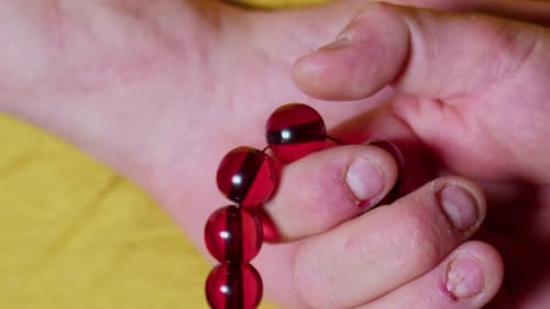 Man Holding Rosary In Hand 1